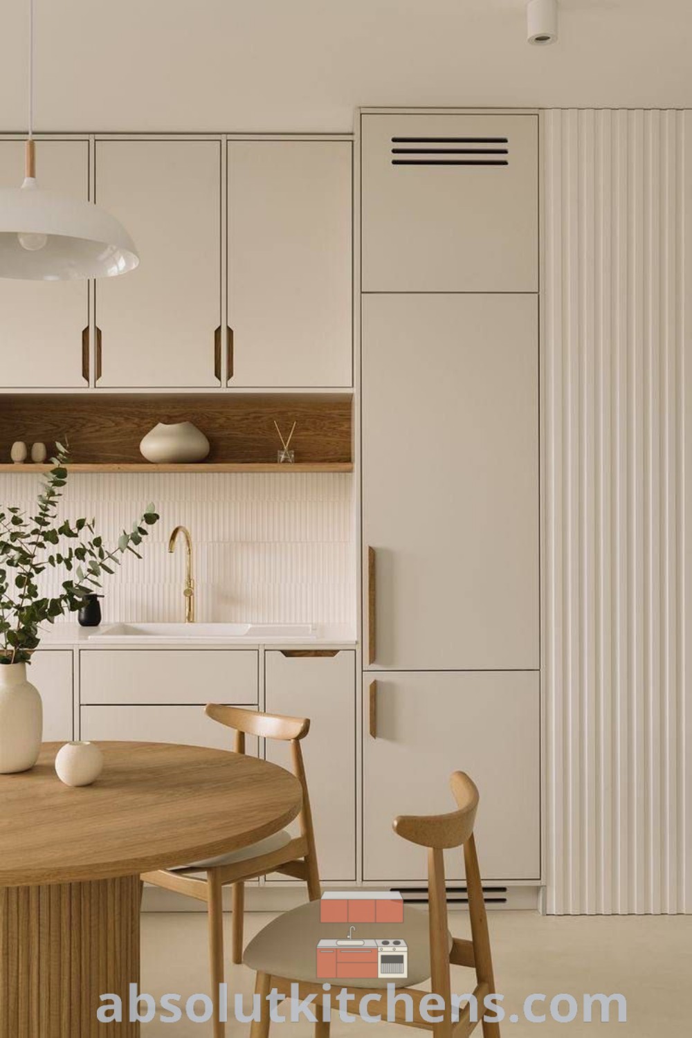 A clean and ready-to-use minimalist kitchen featuring full-length cabinets and Japandi style decor, showcasing small kitchen interior design ideas. This modern minimalist kitchen is both functional and inspiring, offering decor inspirations for creating a cozy home. Find more design ideas at wellnesswink.com.