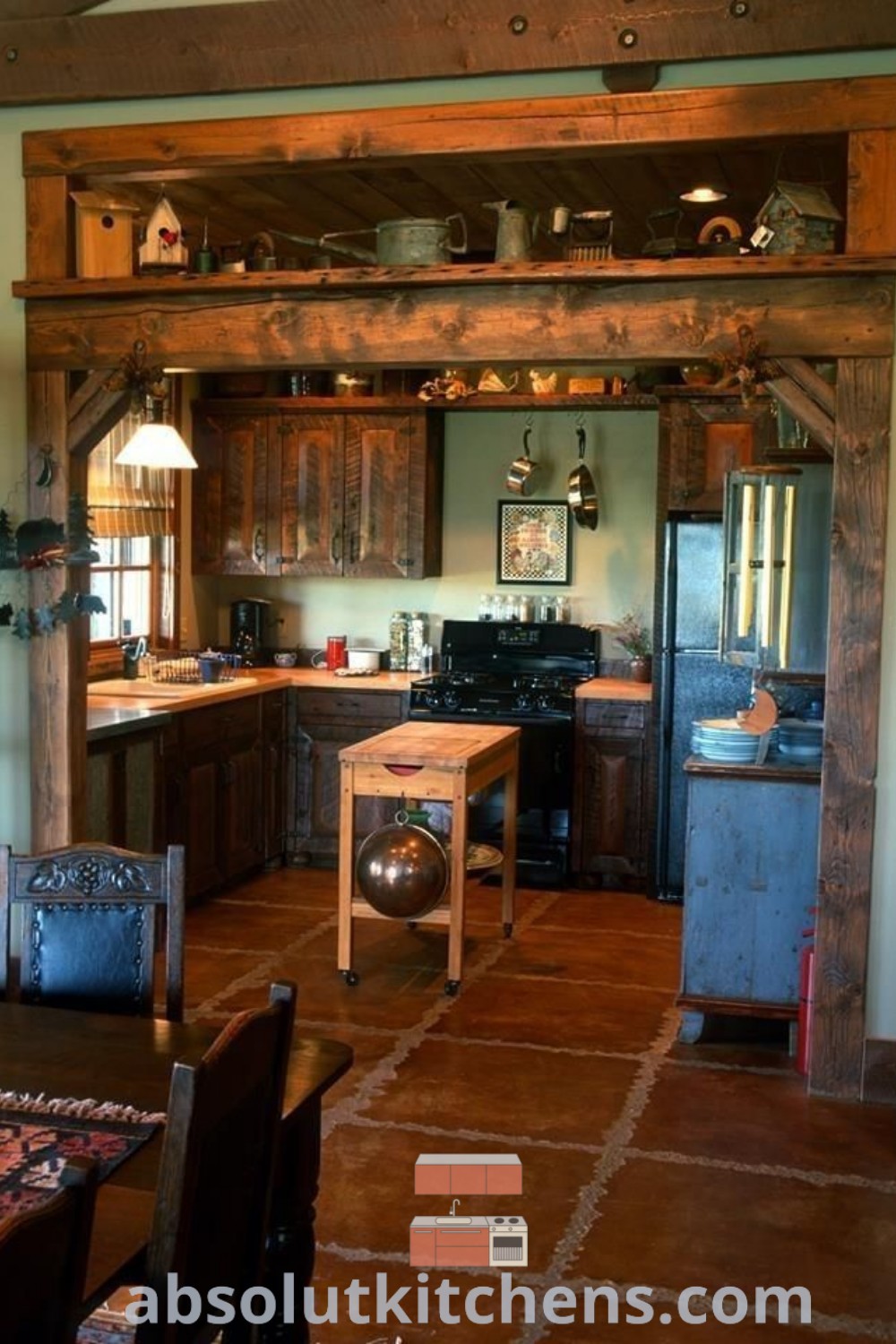 A whimsigothic kitchen showcasing an oven, stove, and a dining room table, offering a cozy aesthetic and unique decor ideas for small spaces. Explore design trends and inspiring decorating ideas for your home at absolutkitchens.com.