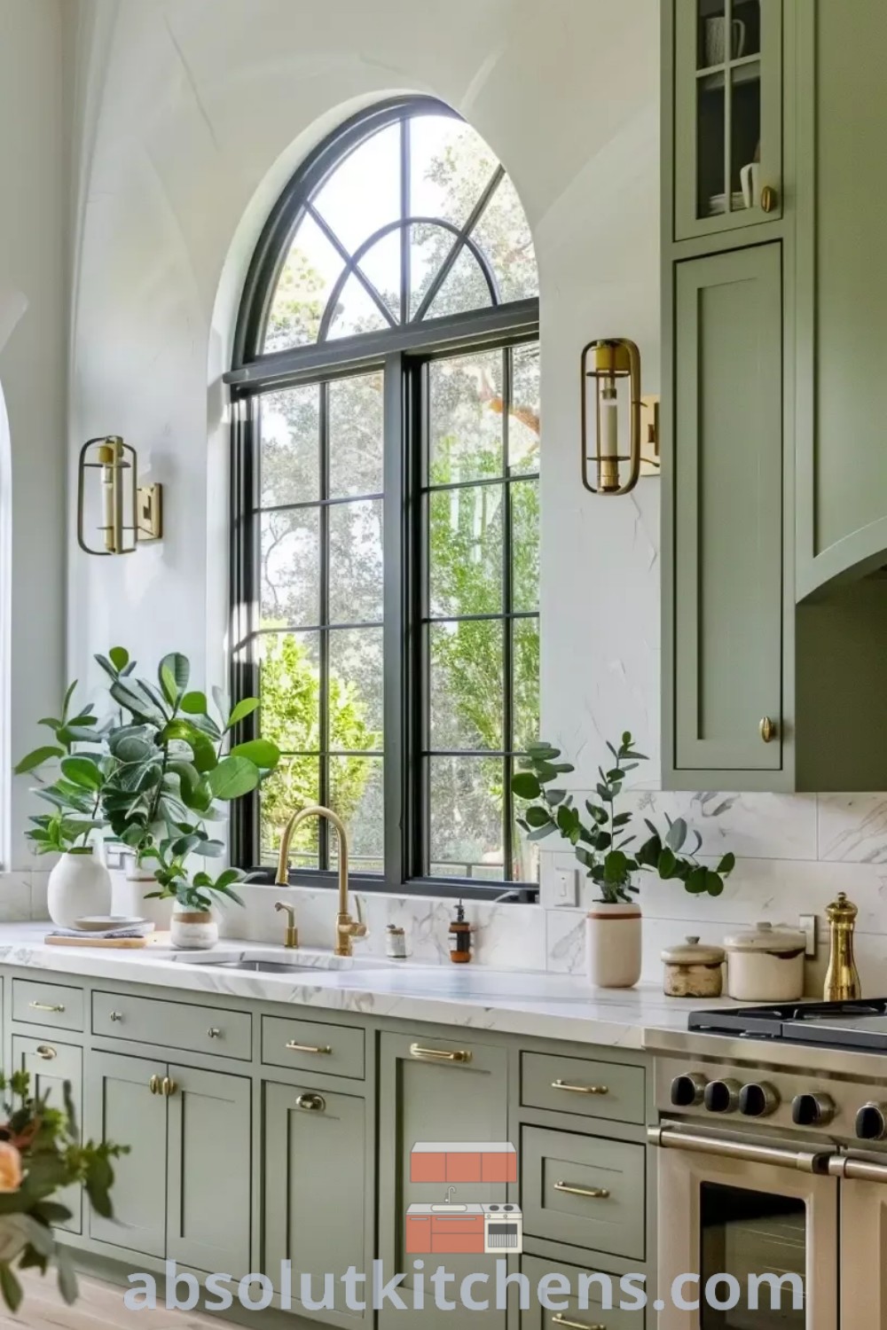 A beautiful kitchen showcasing green cabinets, brightened by an elegant arched window, creating a cozy and inspiring space. This design reflects current trends and offers innovative decorating ideas for small spaces at absolutkitchens.com.