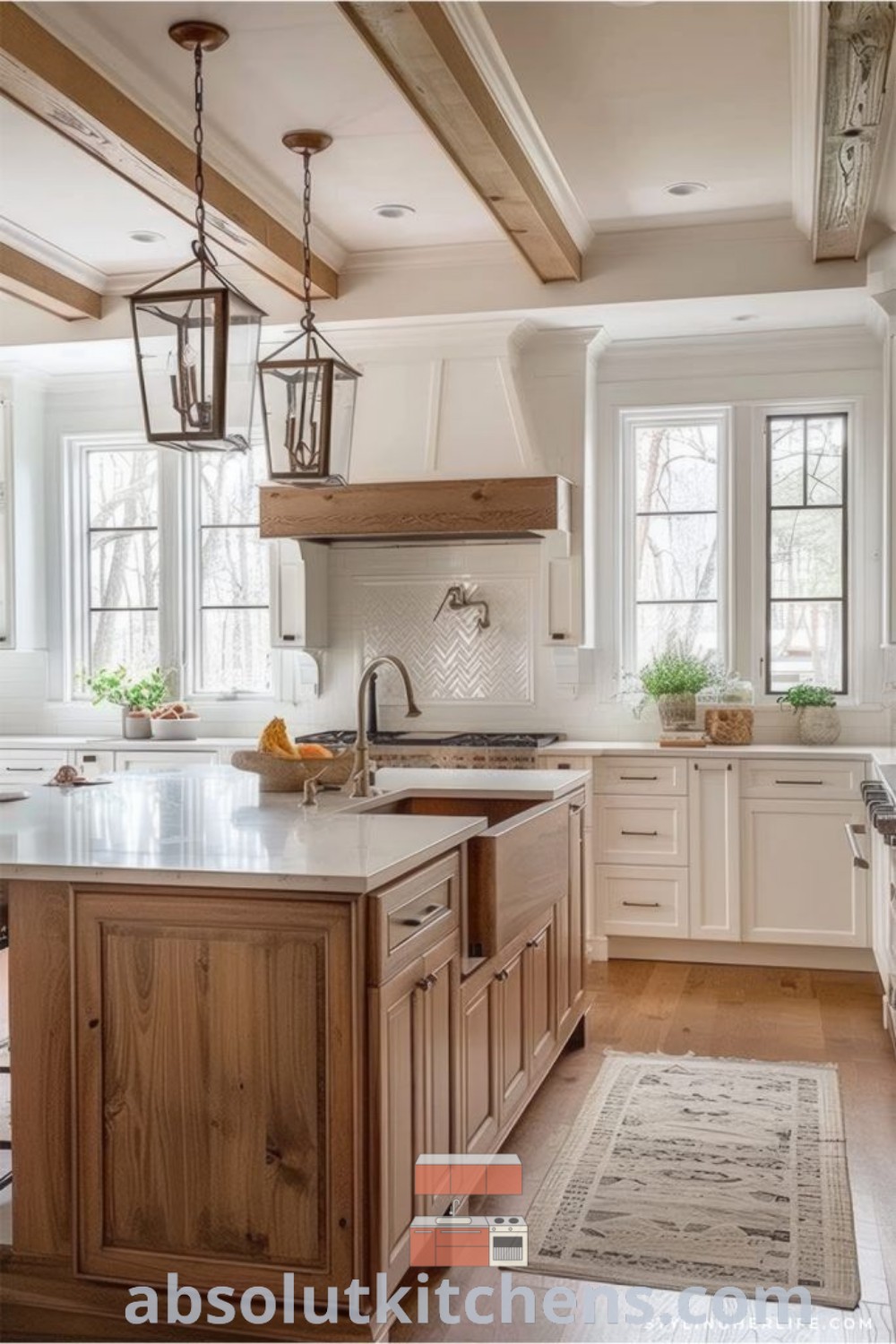 A spacious lakehouse kitchen with white cabinets, wooden flooring, and an island in the center, showcasing modern farmhouse and lake house kitchen ideas. This inviting space combines functionality and style, perfect for anyone seeking decor ideas for their new build kitchen or farmhouse kitchen design. Explore more at absolutkitchens.com.