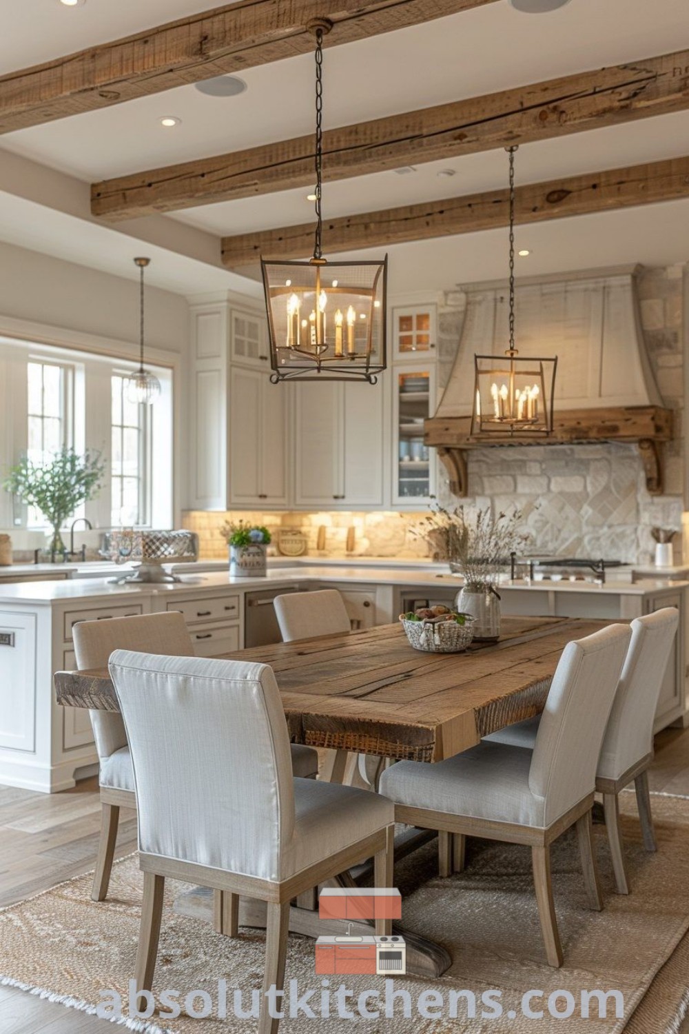 A dining room with a table and chairs in front of a kitchen island featuring hanging lights, reflecting French country kitchen style and transitional design trends. This cozy aesthetic is perfect for creating functional and inviting spaces in your home. Discover inspiring decor ideas for small spaces at absolutkitchens.com.