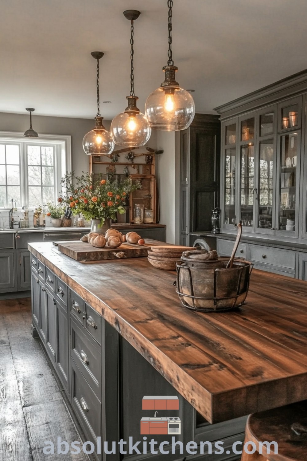 A large rustic modern kitchen with wooden countertops and hanging lights over the island, showcasing inspiring farmhouse kitchen decor ideas. This cozy space combines functional design with vintage charm, offering tips for creating a warm atmosphere in your home. Find more design tips at absolutkitchens.com.