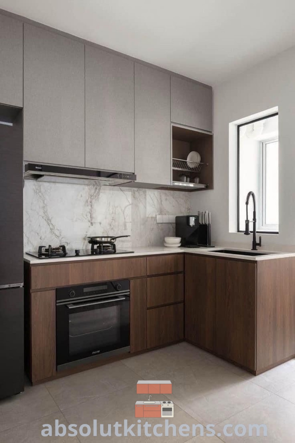 An empty kitchen featuring wooden floors and white cabinets, creating a cozy and inviting atmosphere. This modern kitchen design offers a blank canvas for unique decor ideas, perfect for home decor enthusiasts. Explore more kitchen design plans and inspirations at wellnesswink.com.