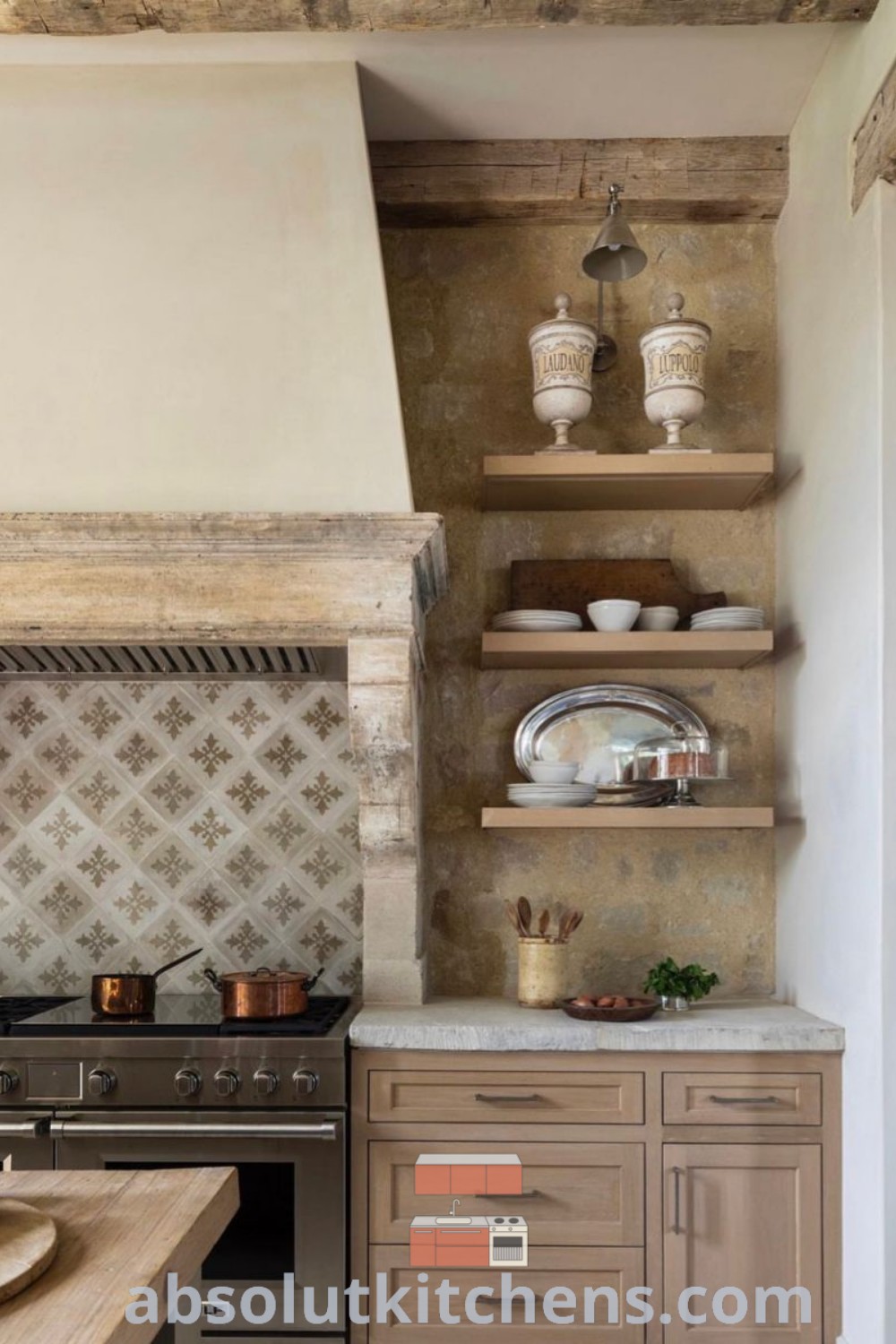 A clean and inviting Italian kitchen featuring open shelves, a decorative stove hood, and Mediterranean decor. It combines cozy aesthetics with functional design, perfect for inspiring kitchen ideas for your house or apartment. Discover more decor ideas at absolutkitchens.com.