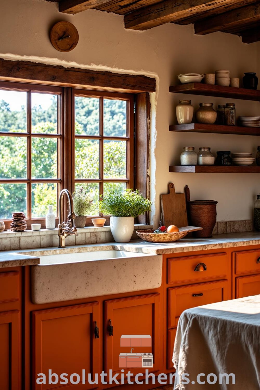 Rustic kitchen with warm orange hues, showcasing weathered cabinets, ceramic bowls, mason jars filled with dried herbs, a vintage farmhouse sink, and a heavy wooden table adorned with a linen cloth, offering cozy ideas and decor inspirations for your home at fireplacesandwoodstoves.com.