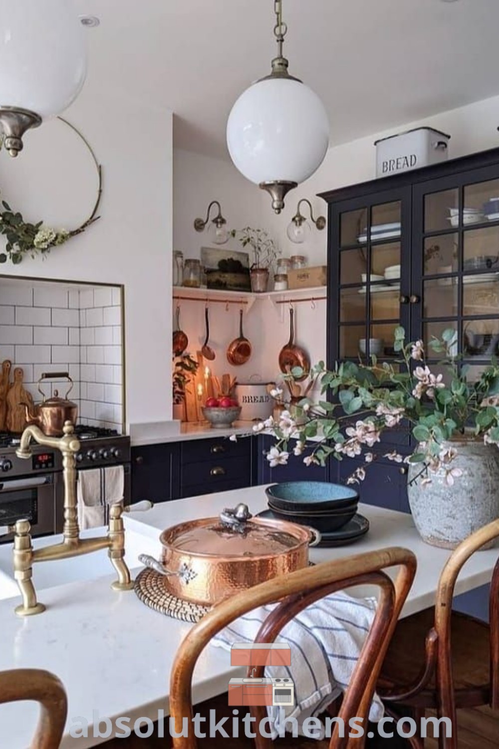 A modern rustic kitchen featuring a hidden fridge, stainless steel backsplash, and a clean aesthetic ready for cooking or baking. Discover design tips for creating a cozy kitchen environment at absolutkitchens.com, offering innovative ideas for homes and apartments.