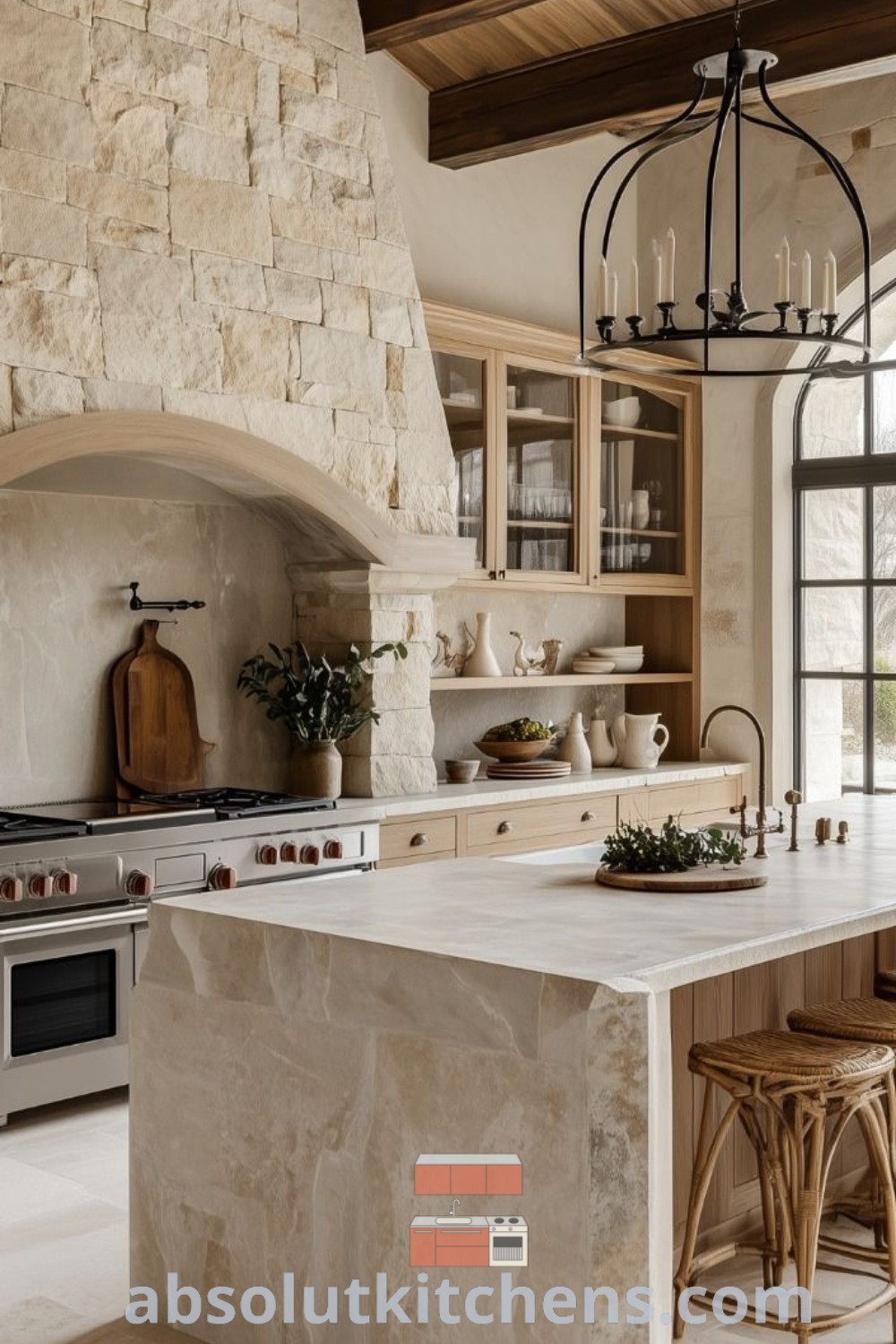 A large kitchen with a central island showcasing rustic country French decor, featuring marble and wood countertops. This cozy French country kitchen design offers design tips and inspiring ideas for decorating a house or apartment, available at absolutkitchens.com.