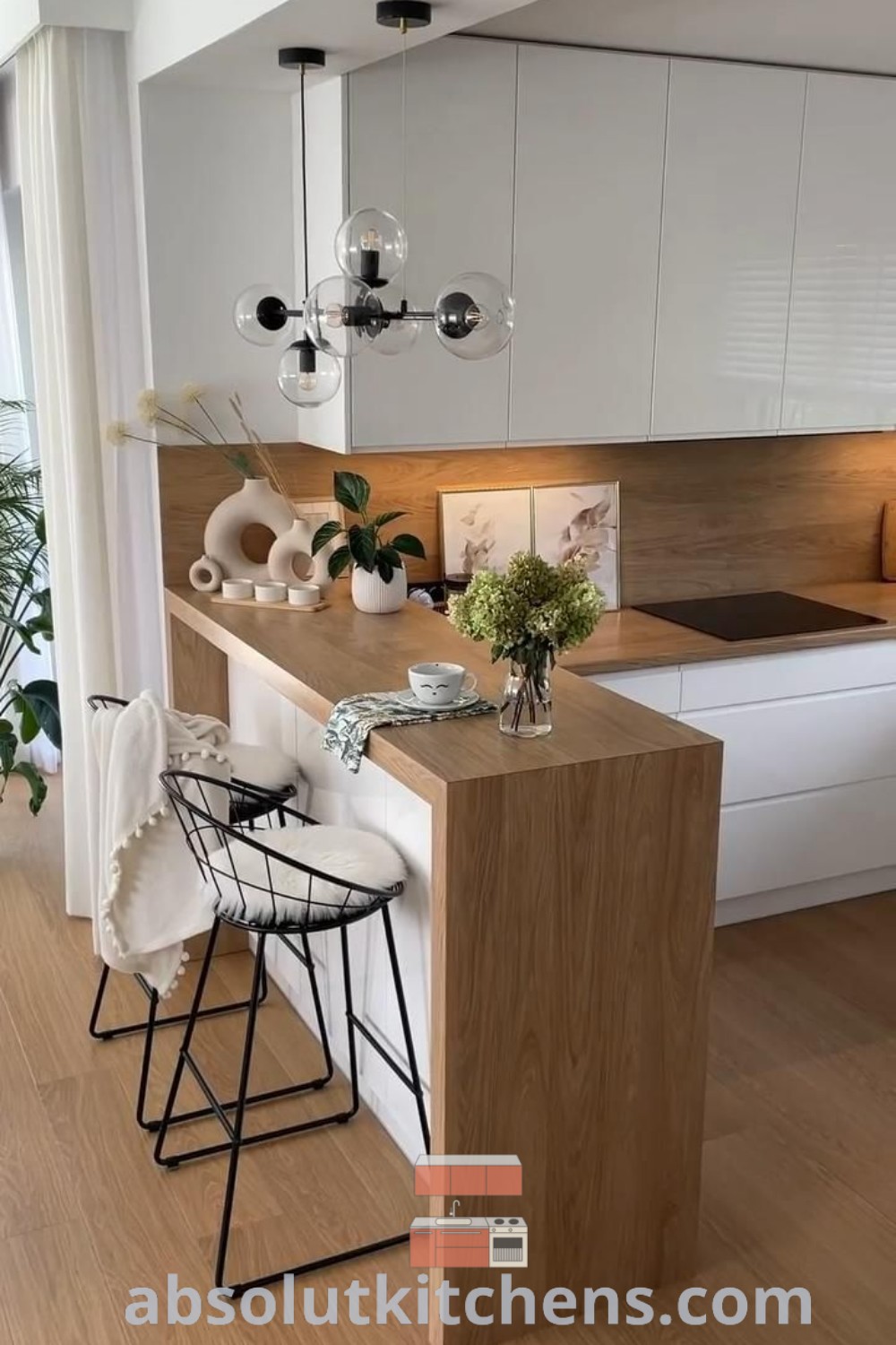 A square kitchen interior design featuring an open counter layout with a DIY kitchen island bar, ideal for small kitchen ideas. The modern minimalist space offers cozy decor inspirations and functional solutions for maximizing small areas, perfect for design enthusiasts seeking unique ideas. Discover more at wellnesswink.com.
