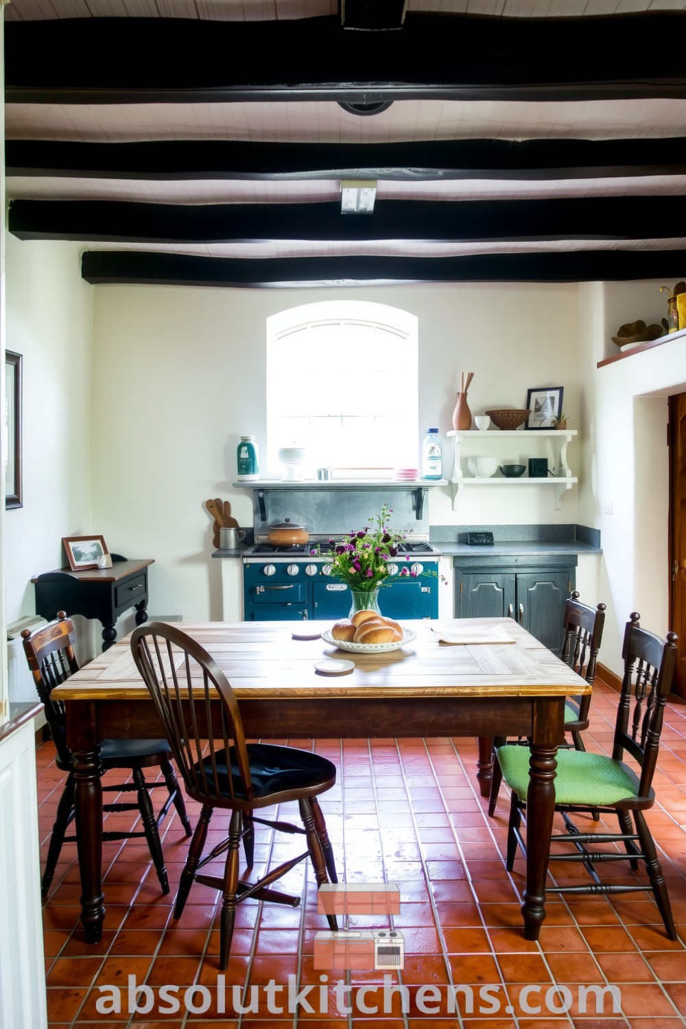 Cozy French kitchen with terracotta tiles, aged wooden beams, a large oak table surrounded by mismatched chairs, and a country-style range under soft sunlight, showcasing inviting decor ideas and cozy inspirations for your home. Visit absolutkitchens.com for more design ideas.