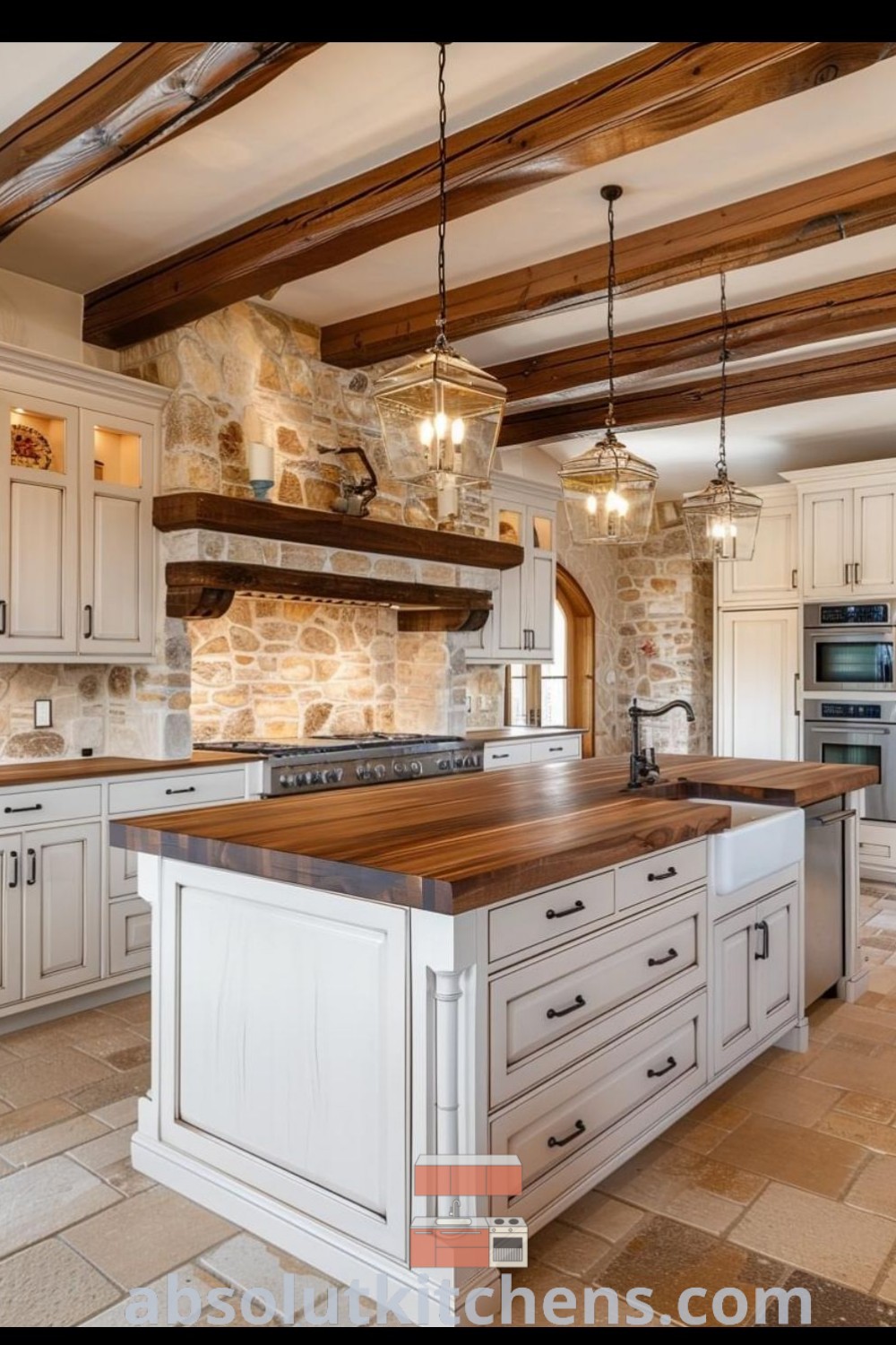 A large kitchen with cream cabinets and butcher block countertops on the island, surrounded by stone walls. This charming kitchen combines functional design with Bohemian decor ideas, creating a cozy aesthetic. Discover more design tips at absolutkitchens.com.
