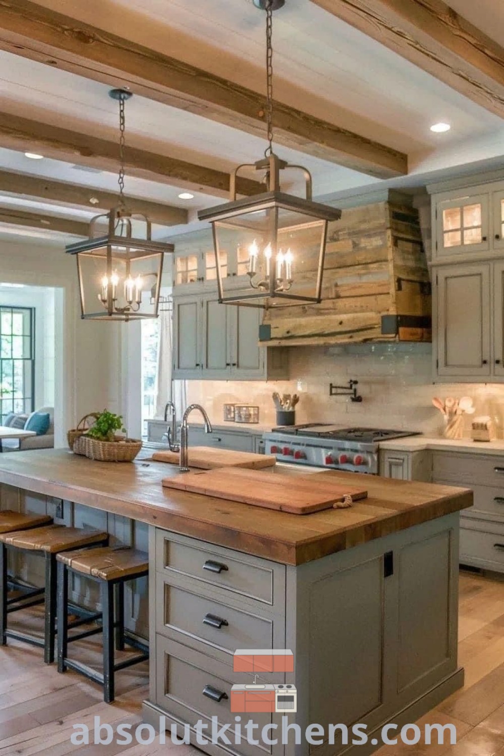 A spacious modular farmhouse kitchen showcasing a large island in the center, complemented by rustic decor ideas and inviting aesthetics. This kitchen design features cozy elements and practical layouts, making it ideal for house renovation ideas. Explore more kitchen inspirations at absolutkitchens.com.