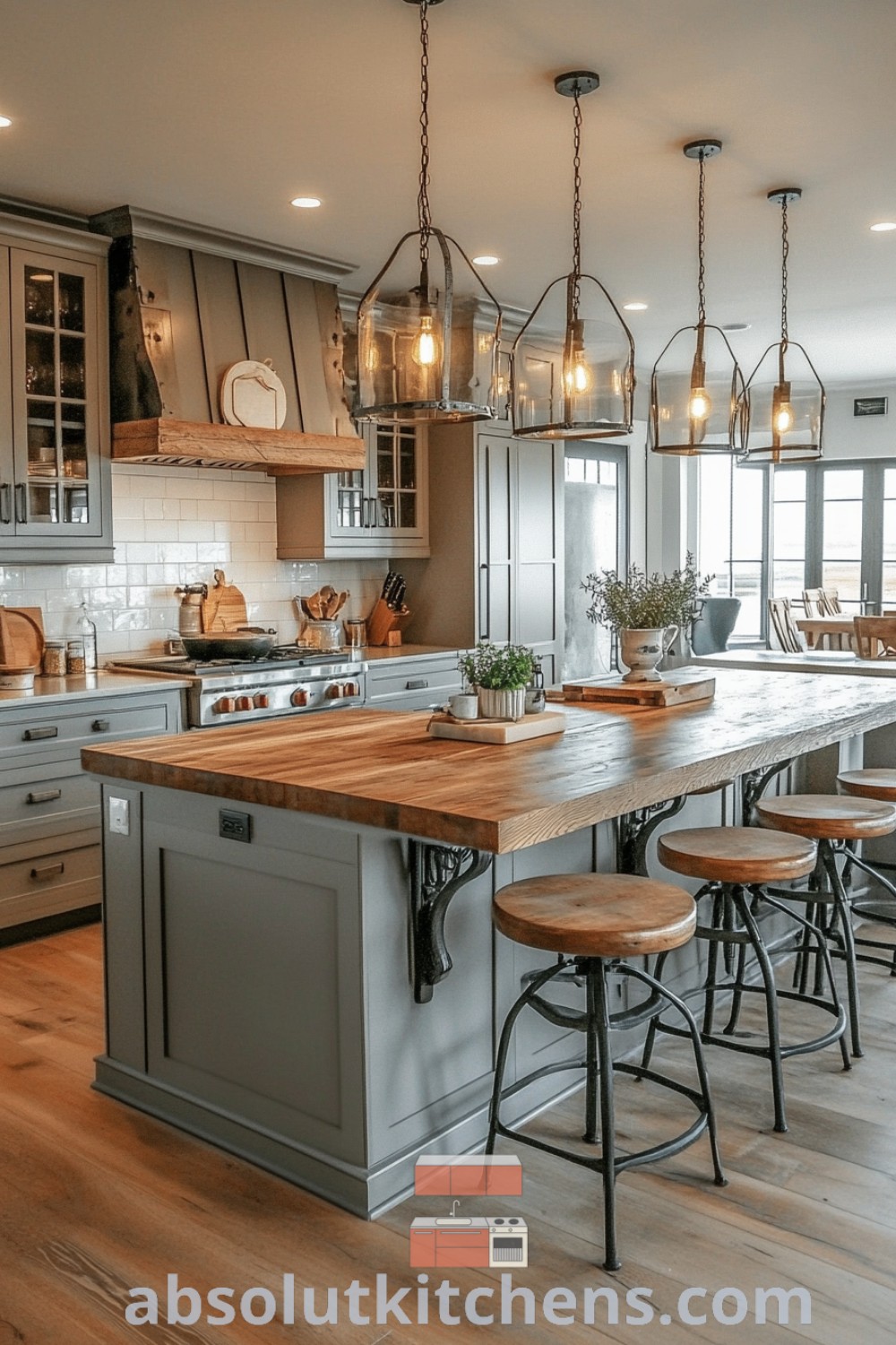 A large kitchen with an island in the middle surrounded by stools, showcasing cream cabinets, butcher block elements, and inviting decor. This farmhouse kitchen exemplifies design trends and cozy aesthetic, providing decor ideas for small spaces. Discover more inspirations at absolutkitchens.com.