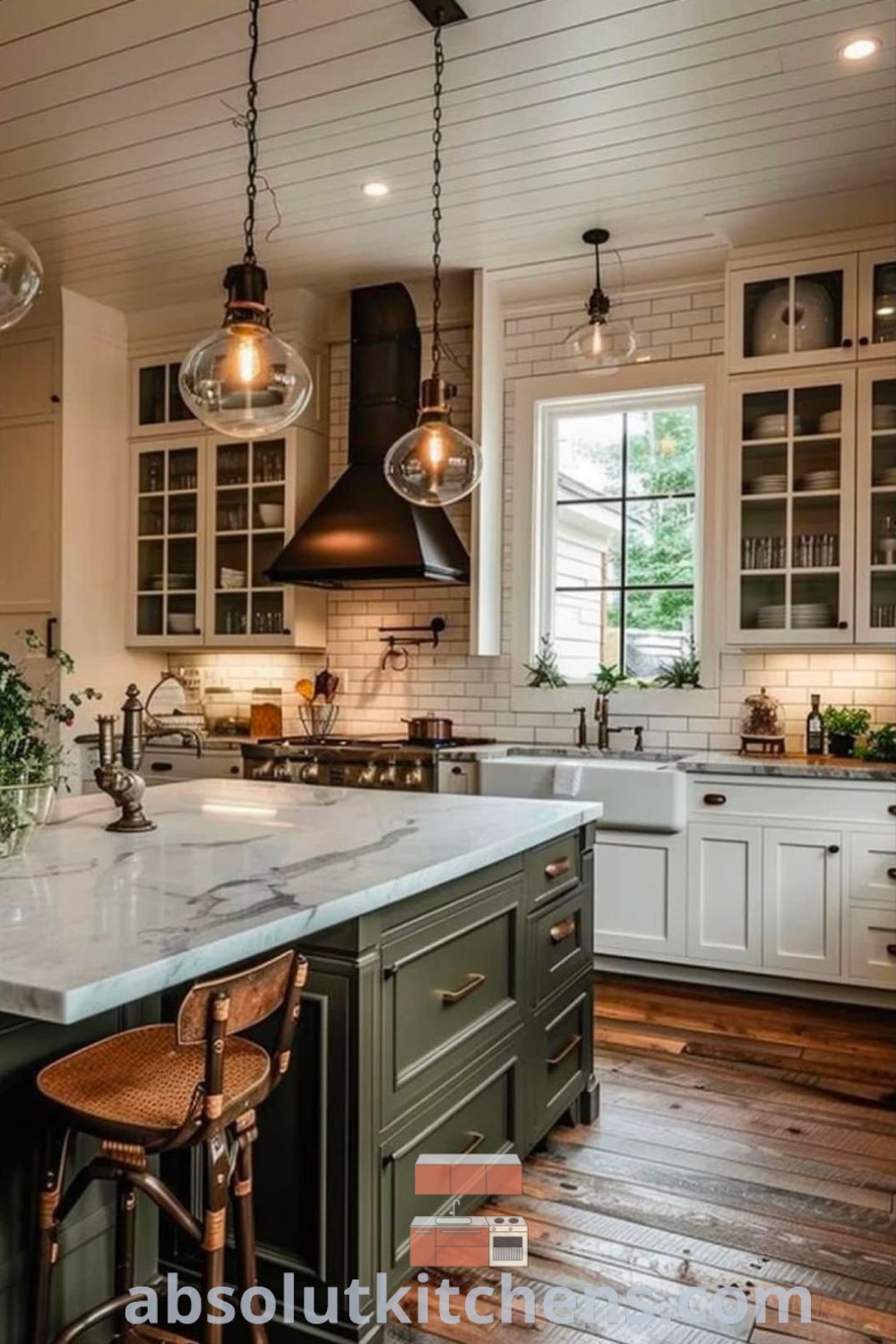 A spacious farmhouse kitchen showcasing a central island with two pendant lights above the stove top, surrounded by inviting wooden flooring. This design offers functional and cozy decor ideas, perfect for kitchen remodel inspiration. Discover more creative kitchen inspiration and design trends at absolutkitchens.com.