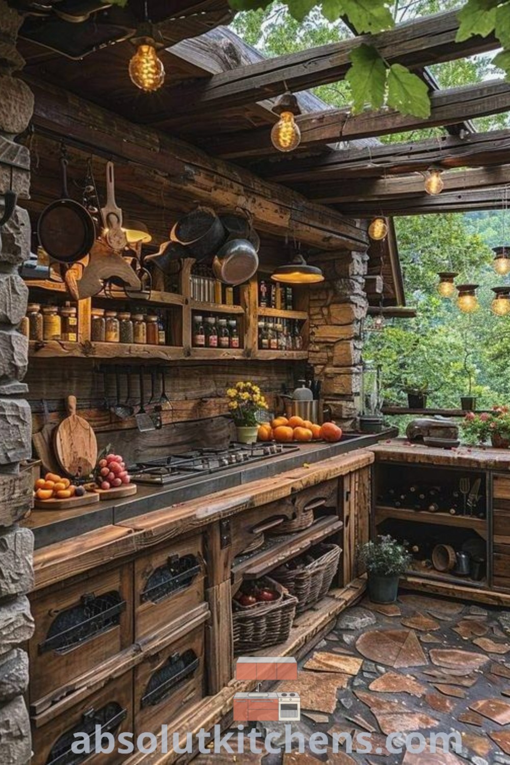A rustic outdoor kitchen with stone flooring and wooden walls built into a log cabin, creating an inviting space for summer cooking. This backyard kitchen design features elements perfect for lakefront homes and tiny house interiors, providing inspiring decor ideas for small spaces. Visit absolutkitchens.com for more kitchen design trends.