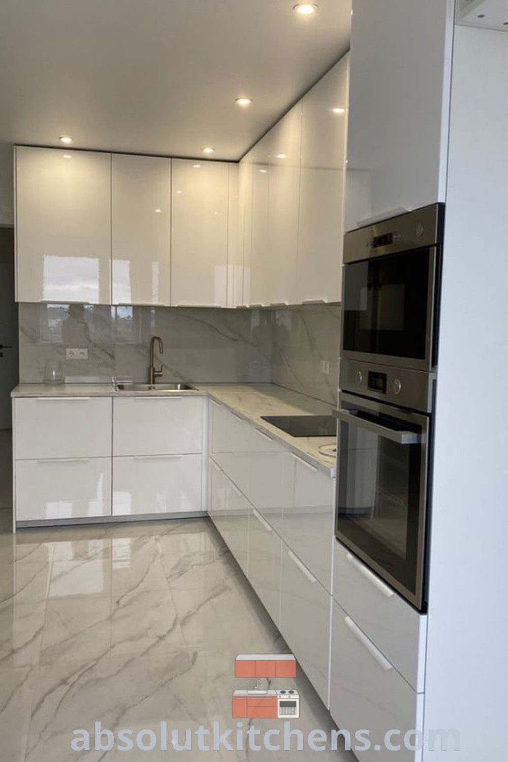 A modern kitchen with white cabinets and wood accents on the countertop, featuring two stools at the island. This design embodies a stylish blend of functionality and decor inspiration, suitable for various kitchen design plans. Explore unique ideas for your home at wellnesswink.com.